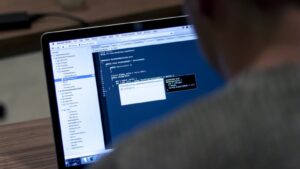 Laptop screen showing programming code